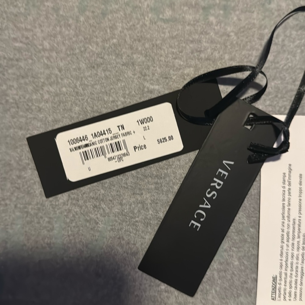 Selling white and pink Versace shit size large